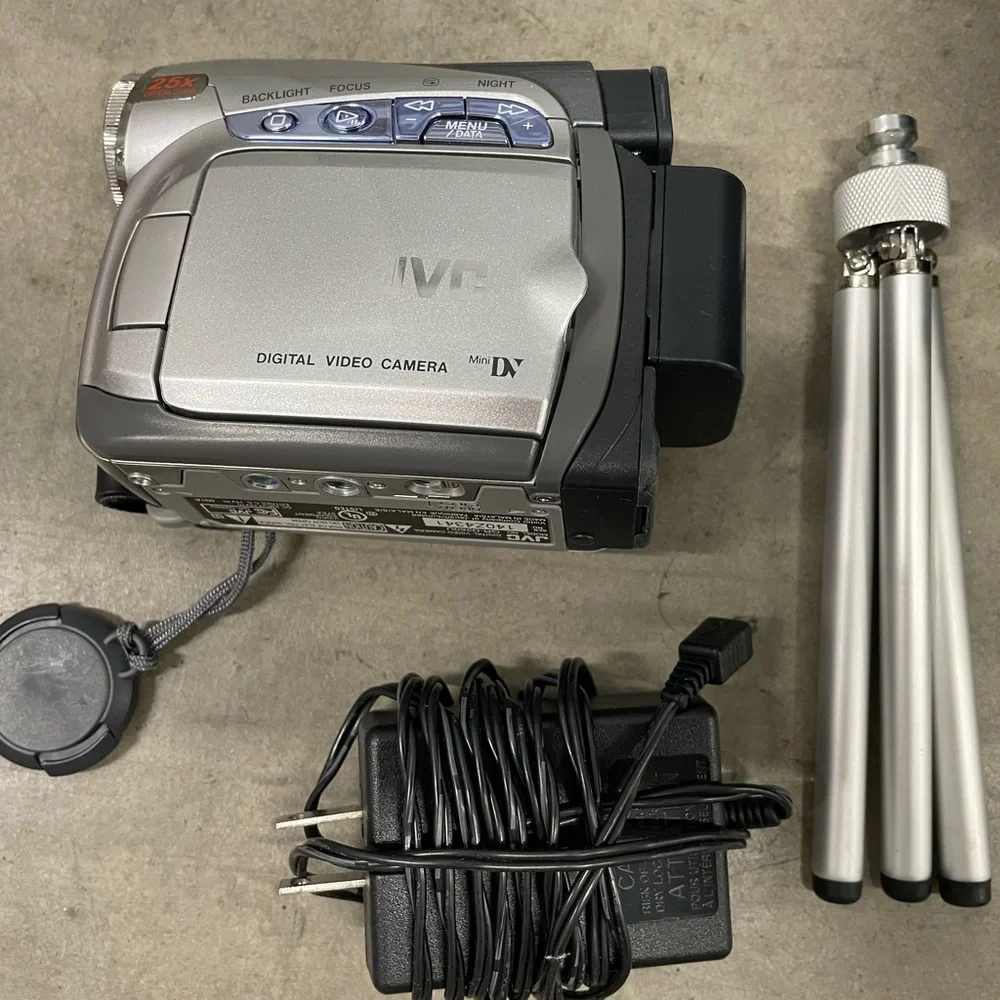 JVC Silver Digital Video Camera with accessories.